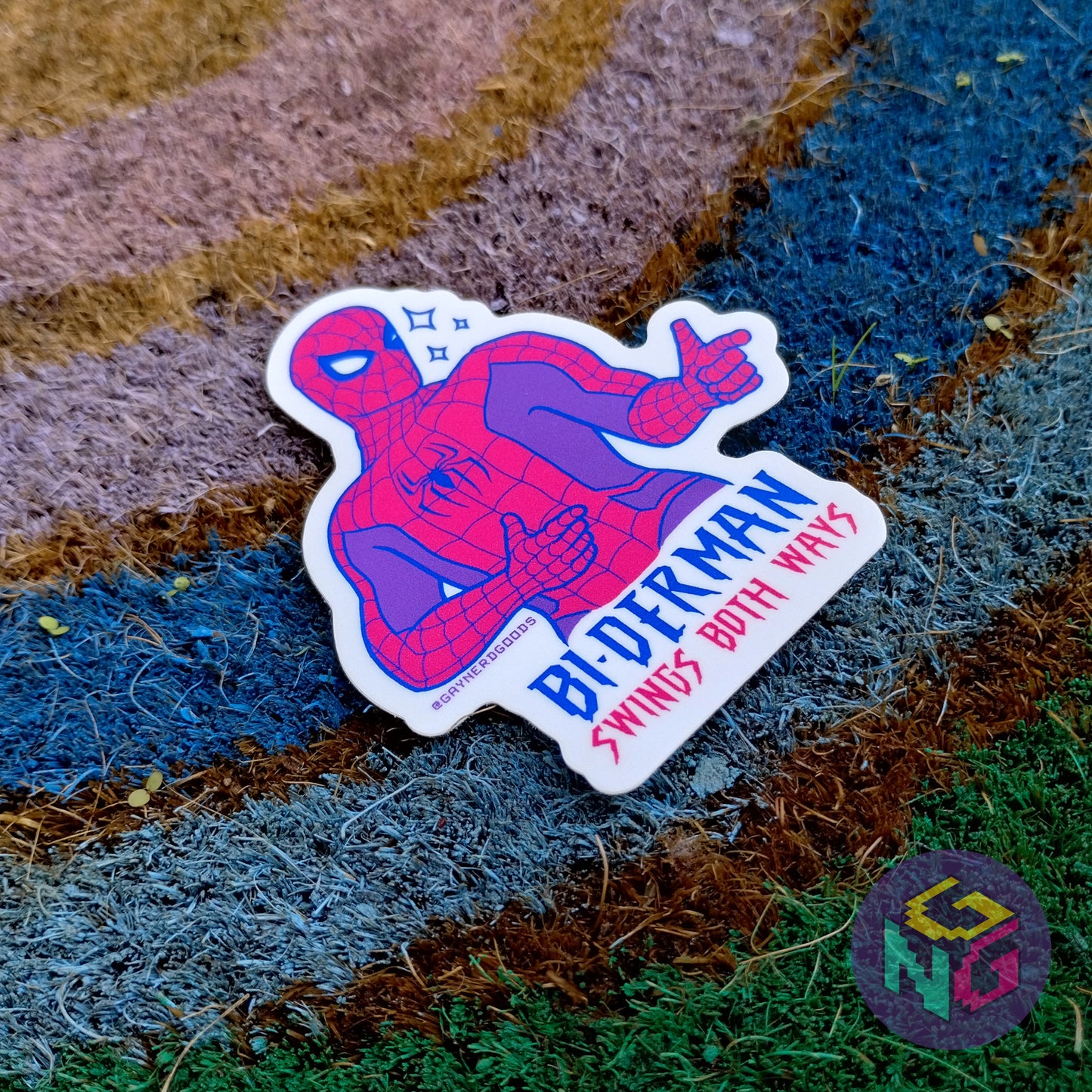 biderman waterproof sticker lying at an angle on a rainbow welcome mat