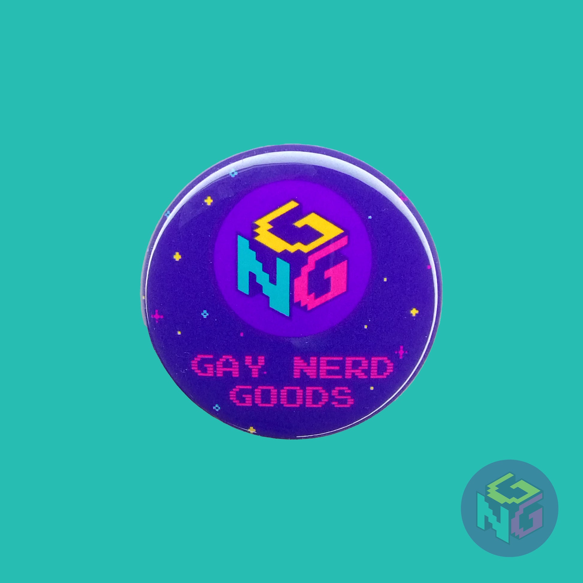 round gay nerd goods logo pin featuring the gay nerd goods 8 bit style GNG logo and text reading "gay nerd goods" on a background of dark purple with pink, yellow, and mint stars
