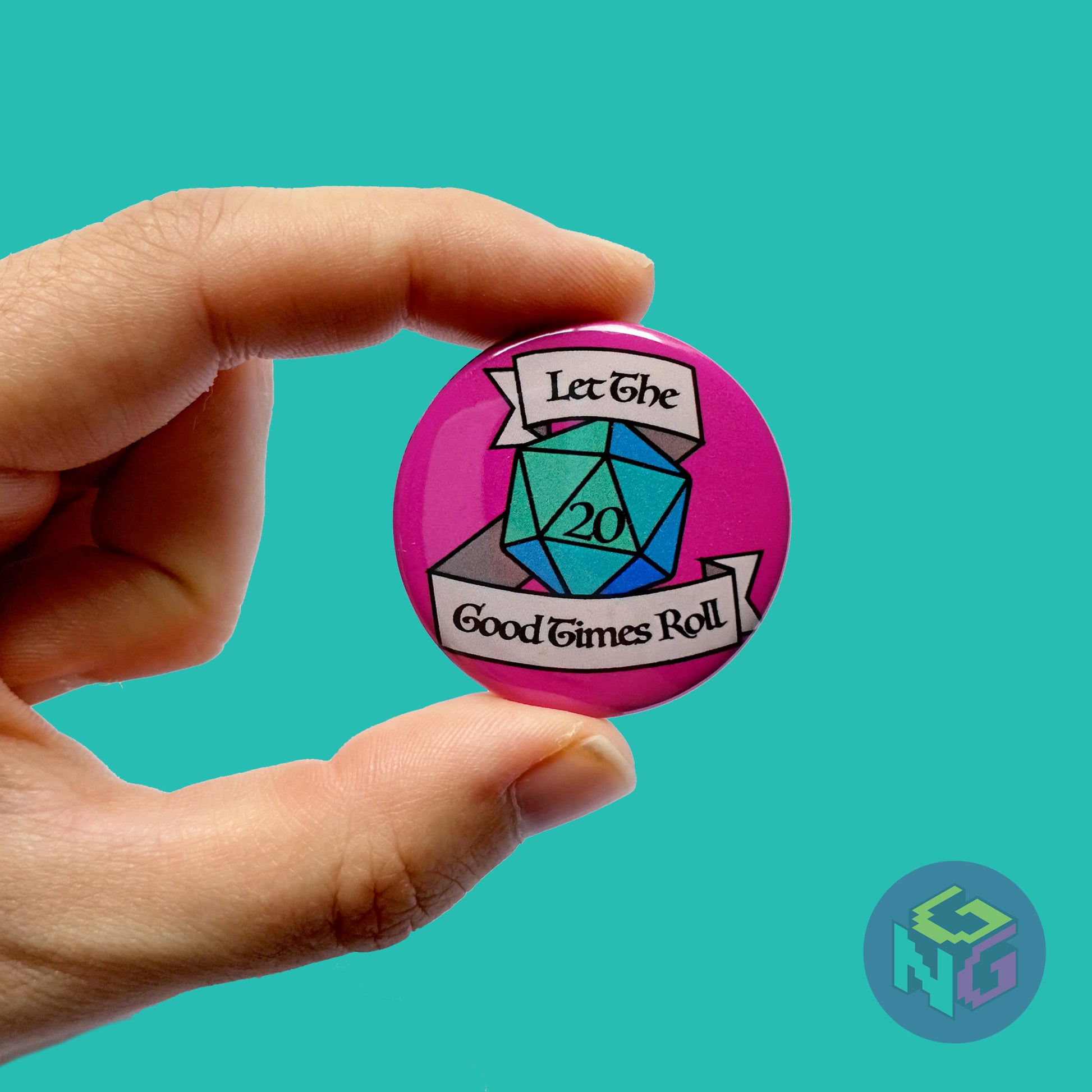 let the good times roll d20 button held in hand in front of mint green background