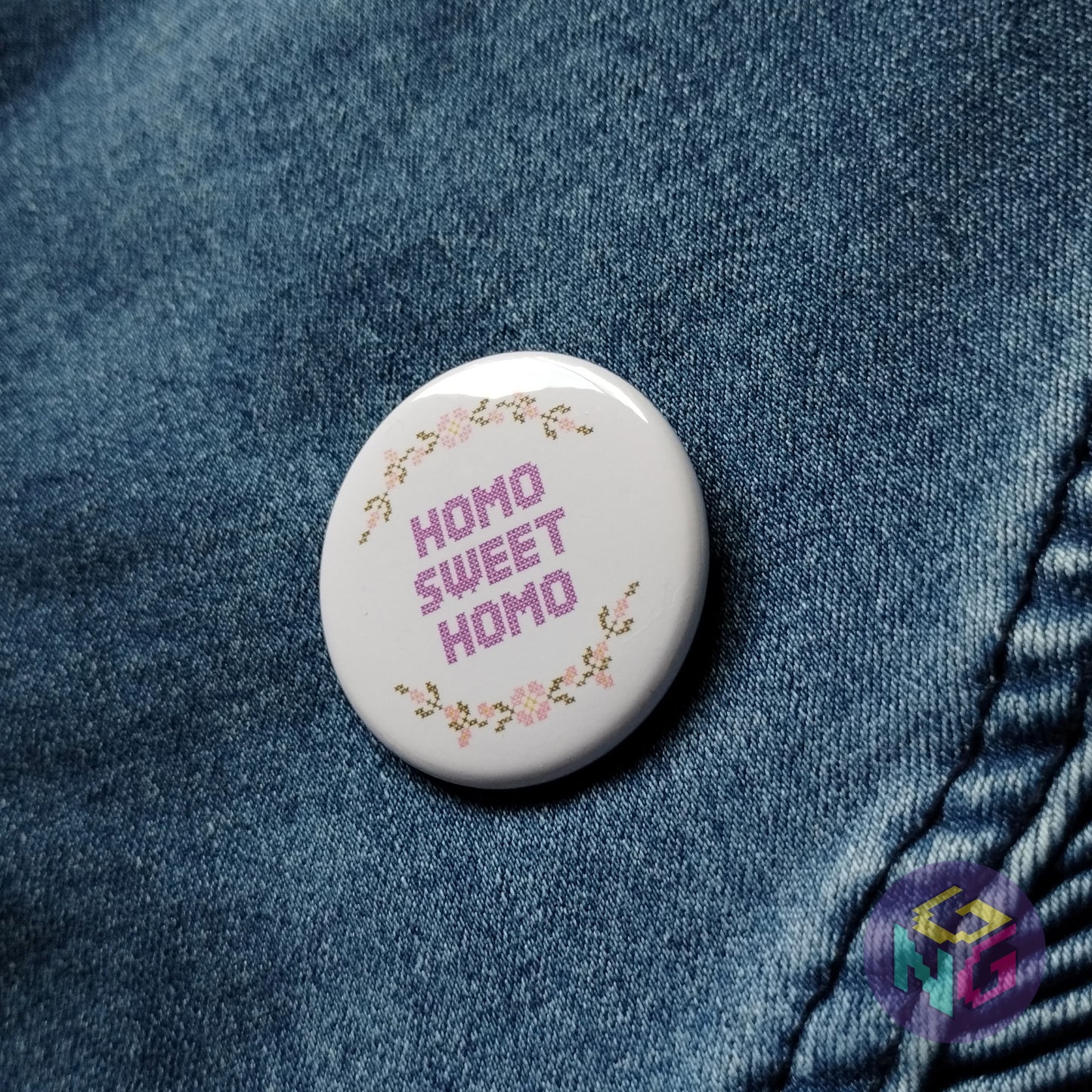 round homo sweet homo pin on denim background
