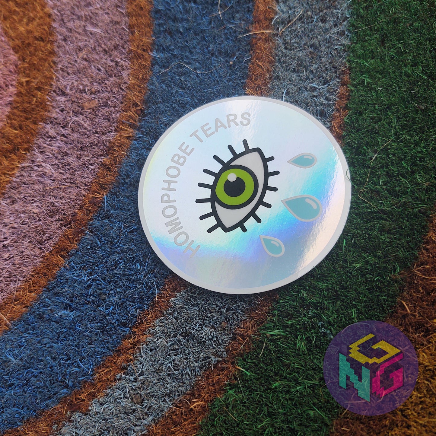 rainbow holographic homophobe tears round sticker on rainbow welcome mat