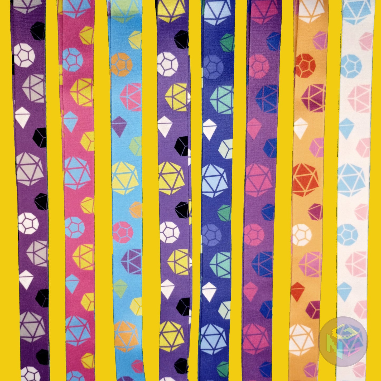 group shot of all eight of the pride dice lanyards showing the options for asexual, pansexual, rainbow, nonbinary, gay, bisexual, lesbian, and transgender