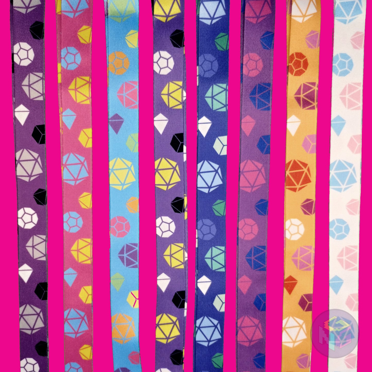 group shot of all eight of the pride dice lanyards showing the options for asexual, pansexual, rainbow, nonbinary, gay, bisexual, lesbian, and transgender