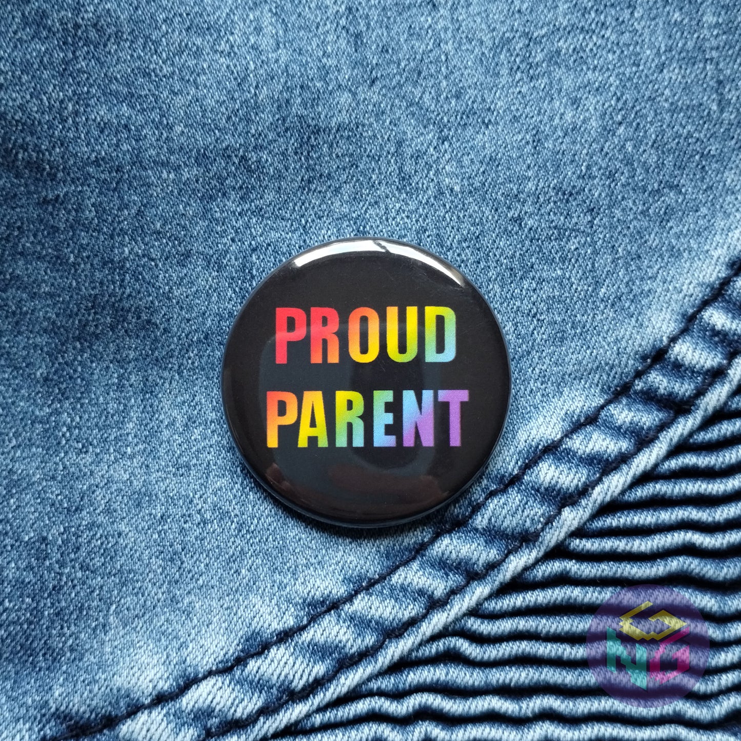 rainbow proud parent button on denim background