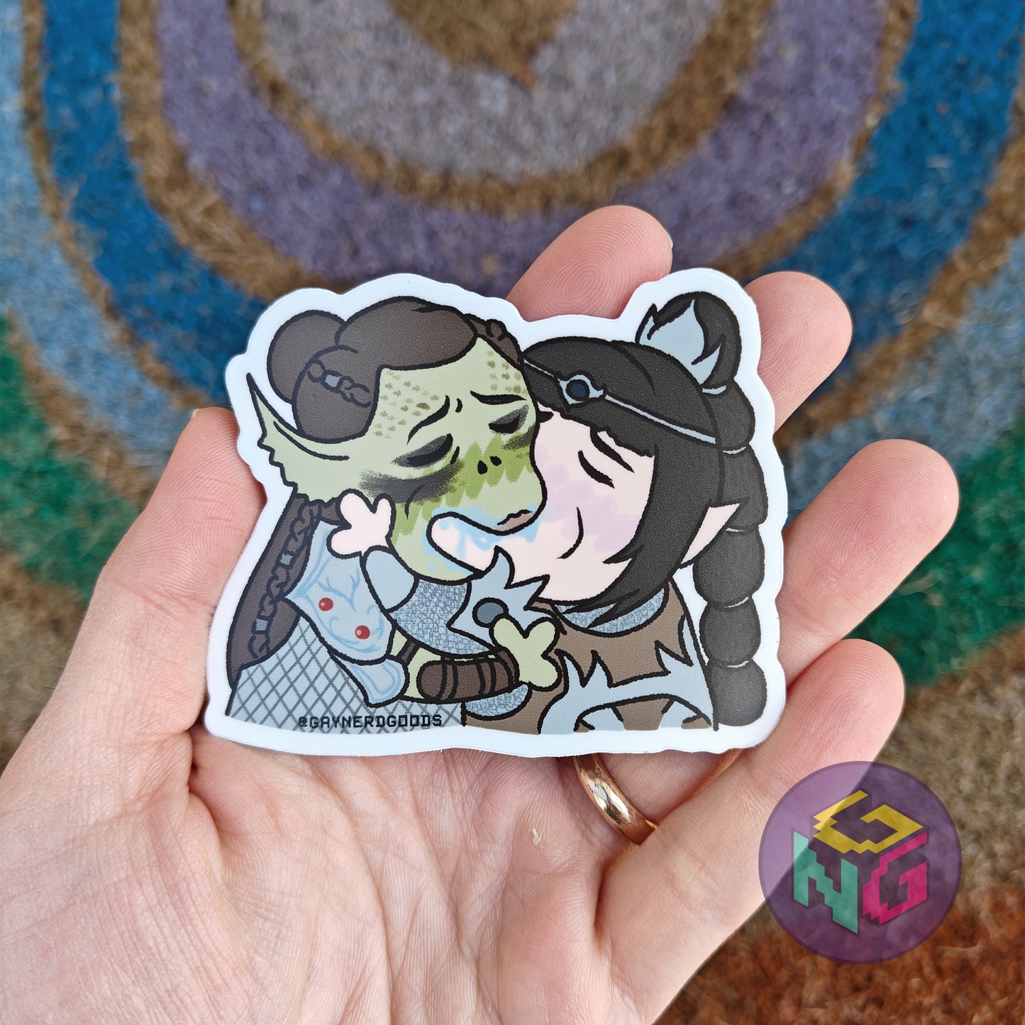 shadowheart and lae'zel kissing waterproof sticker in palm in front of neutral background