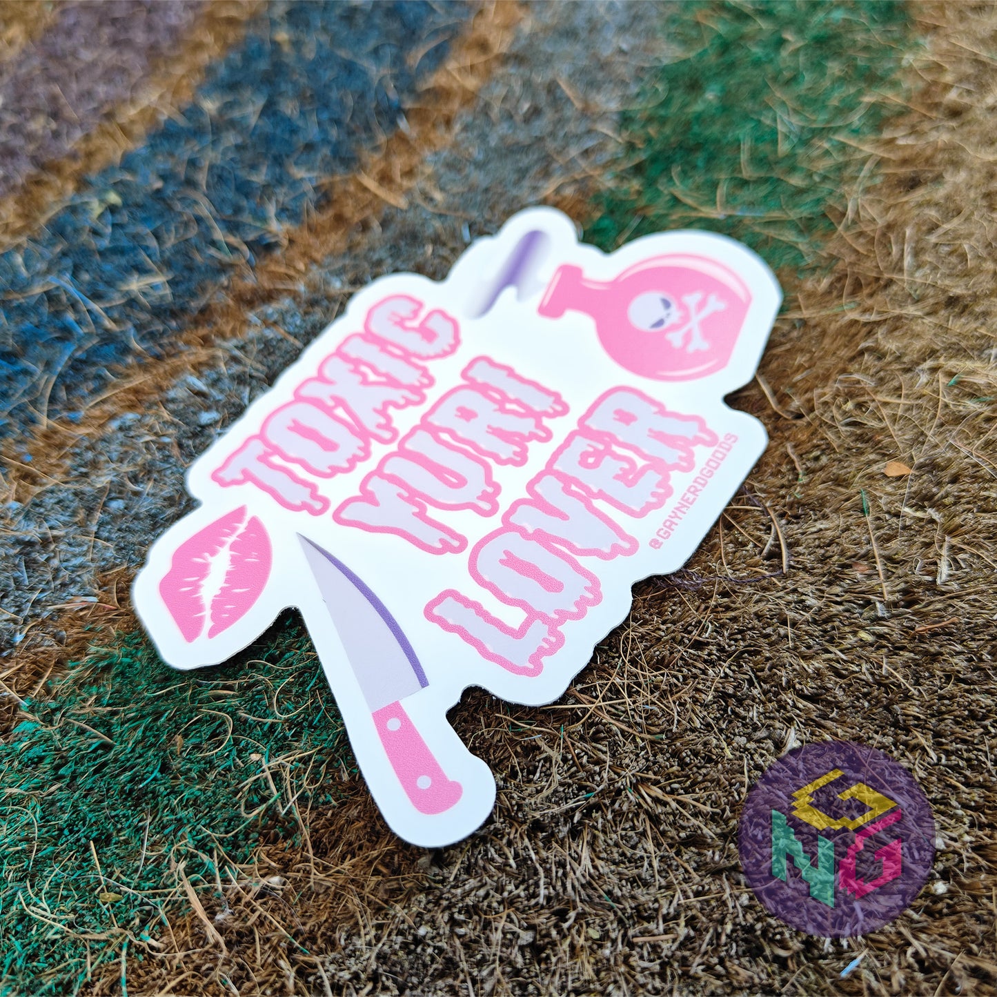 lipstick kiss, knife, and poison bottle surrounding melting toxic yuri lover text