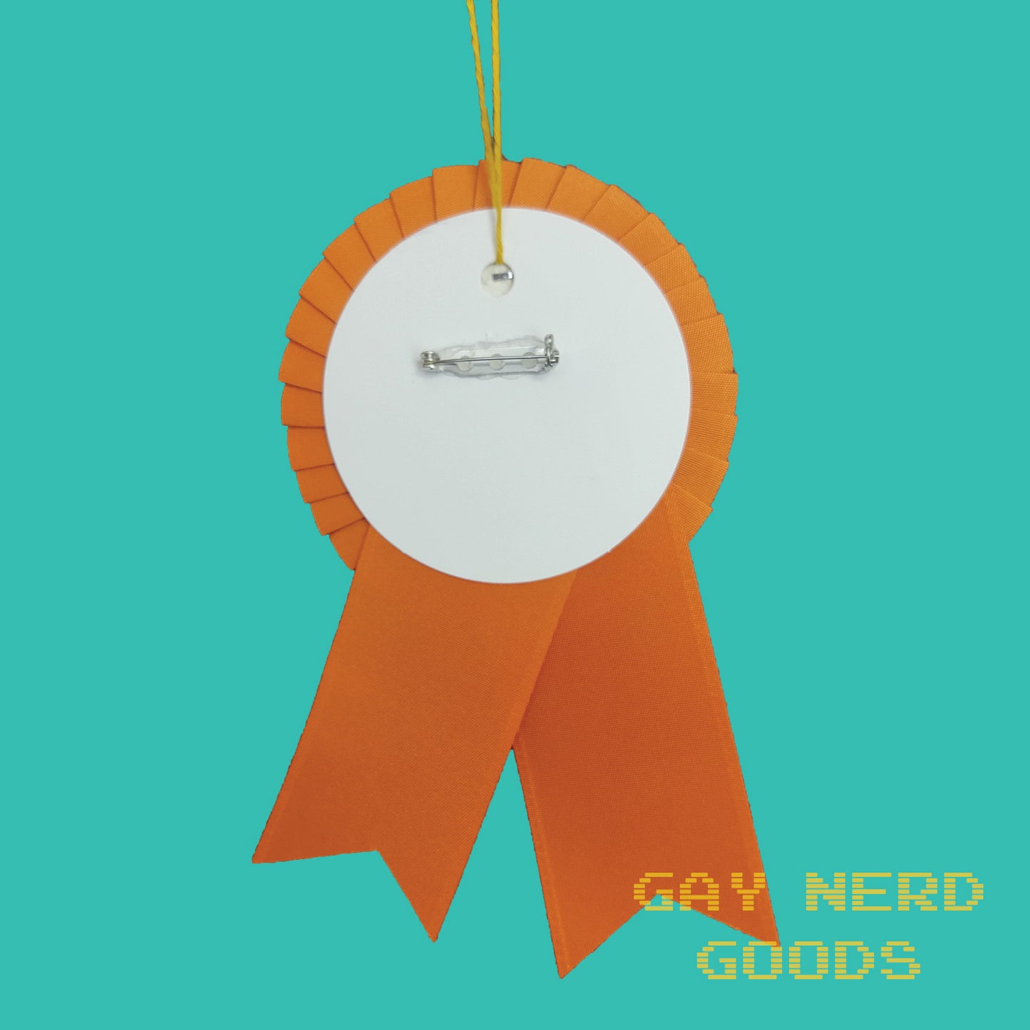 back view of the orange best blorbo award showing the thread loop and pinback