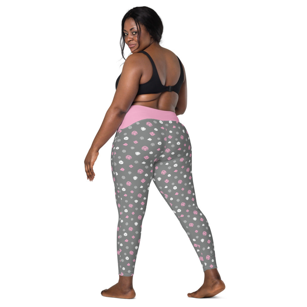 back view of dark-skinned female-presenting plus size model looking over her shoulder. She is wearing the demigirl dice leggings and a black sports bra