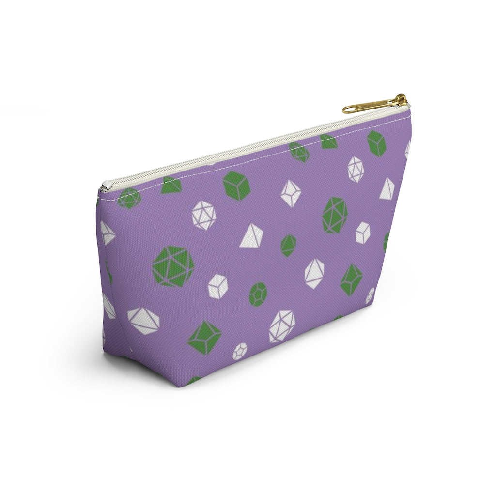 the small genderqueer dice t-bottom pouch in side view on a white background. it's purple with green and white polyhedral dice and a gold zipper pull