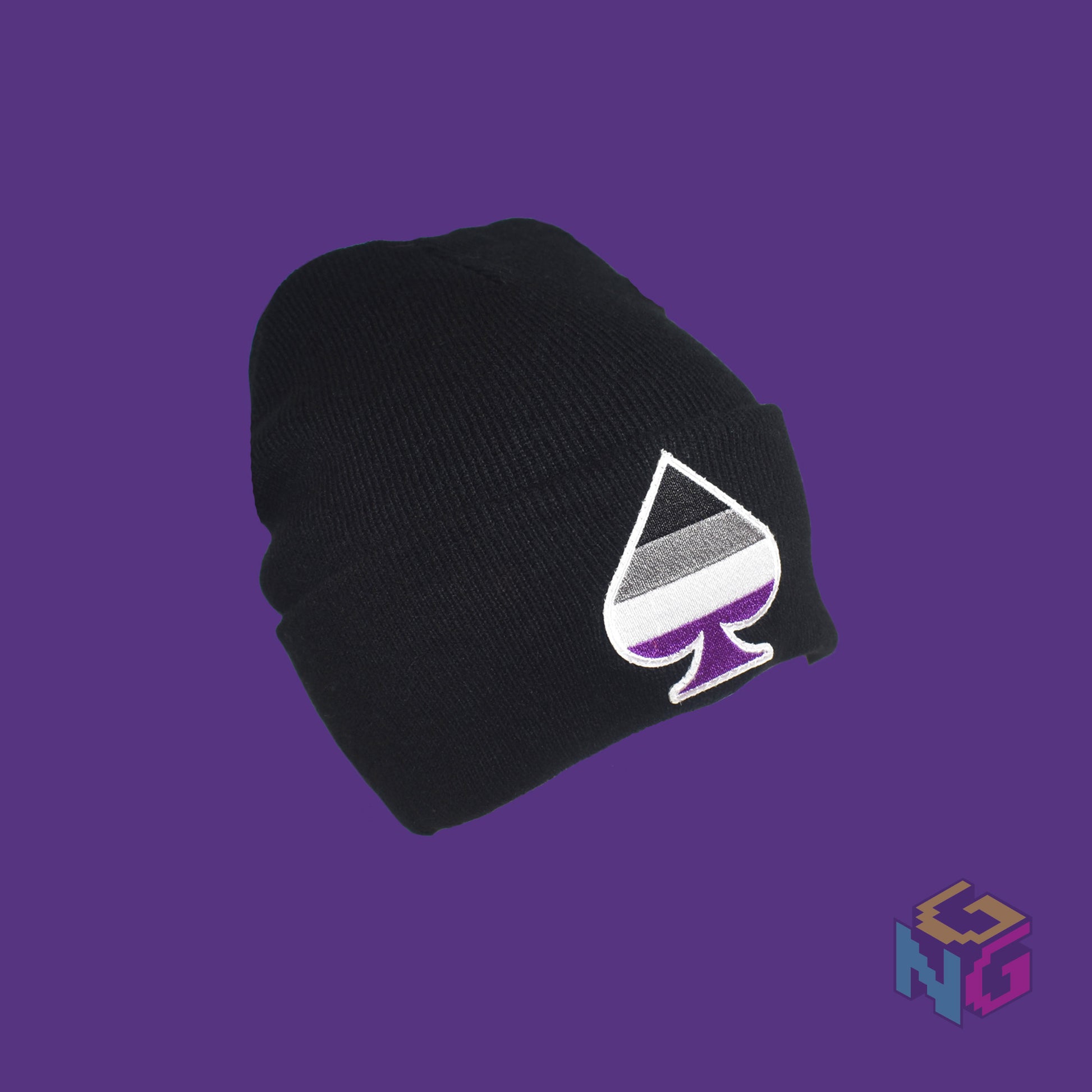 Black knit fabric beanie with the asexual ace of spades symbol in asexual black, white, grey, and purple on the front. It's in a 3/4 view on a purple background