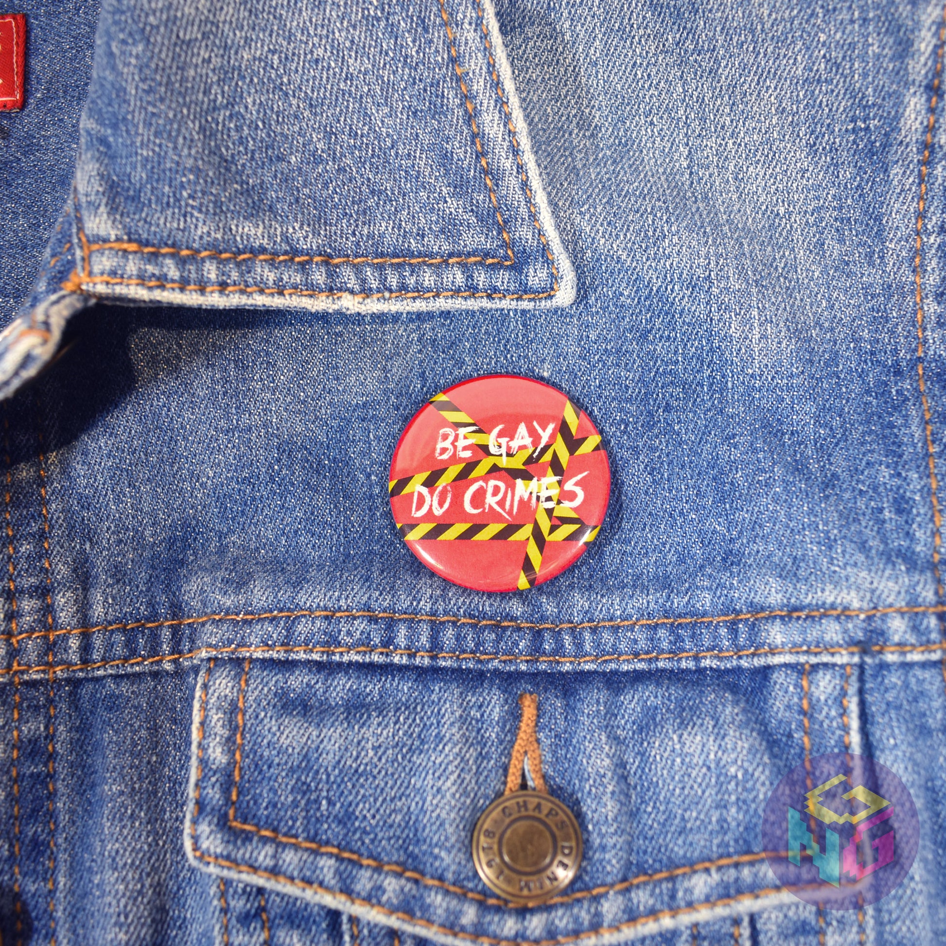 be gay do crimes pin resting on the chest of a denim jacket