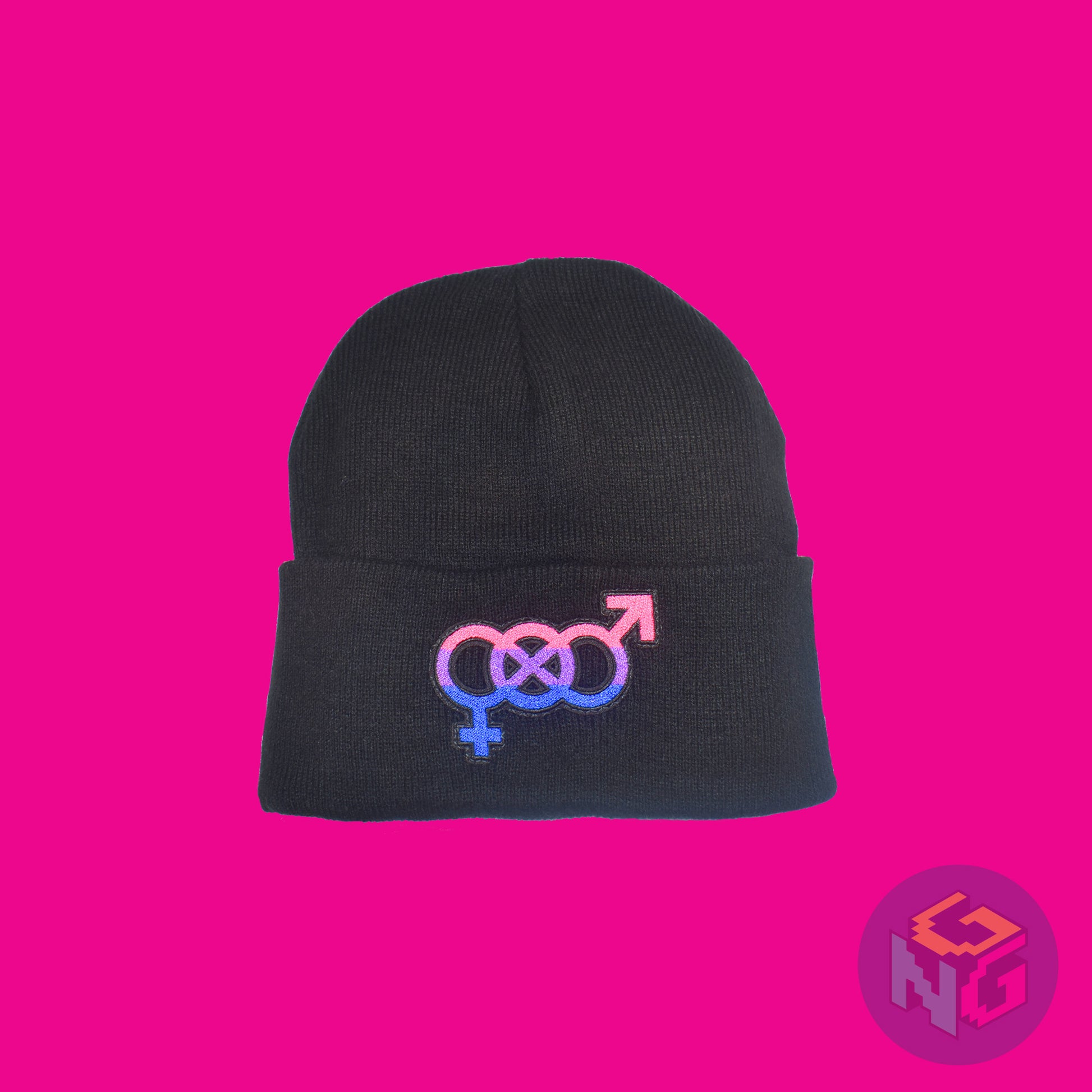 Black knit fabric beanie with the bisexual symbol in asexual pink, purple, and blue on the front. It is laying flat on pink background
