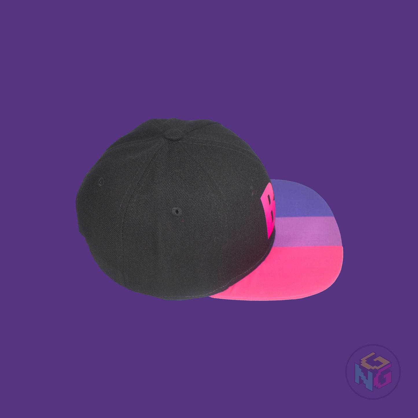 Black flat bill snapback hat. The brim has the bisexual pride flag on both sides and the front of the hat has the word “BI” in pink and blue. Top right view