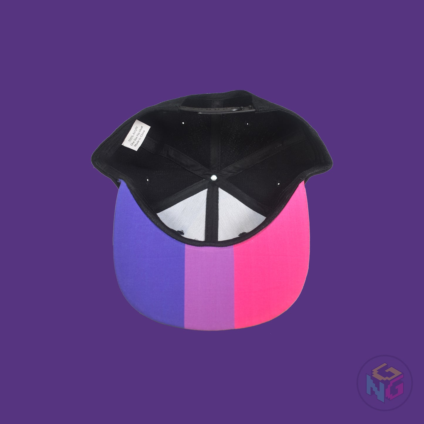 Black flat bill snapback hat. The brim has the bisexual pride flag on both sides and the front of the hat has the word “BI” in pink and blue. Underside view