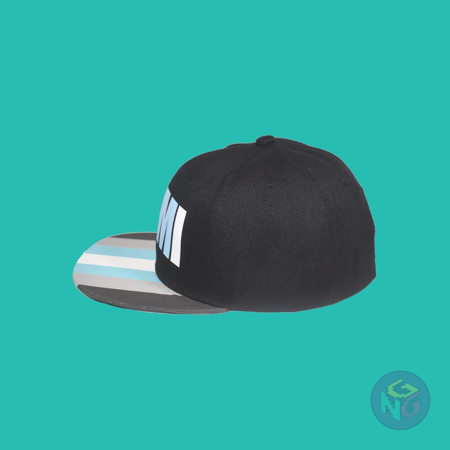 Black flat bill snapback hat. The brim has the demiboy pride flag on both sides and the front of the hat has the word “DEMI” in dark grey, light grey, blue, and white. Left view