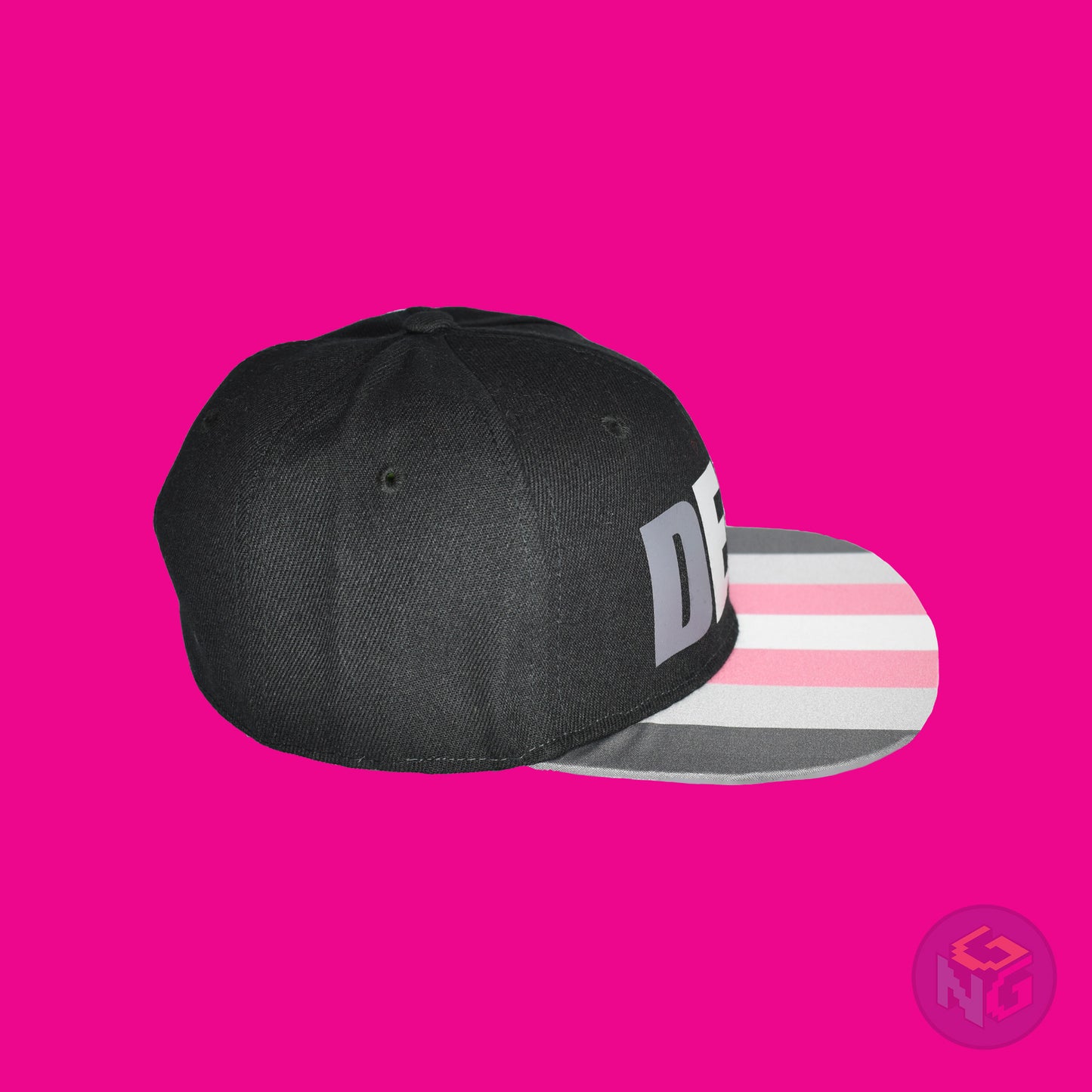 Black flat bill snapback hat. The brim has the demigirl pride flag on both sides and the front of the hat has the word “DEMI” in dark grey, light grey, pink, and white. Right view