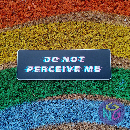do not perceive me sticker lying flat on rainbow welcome mat