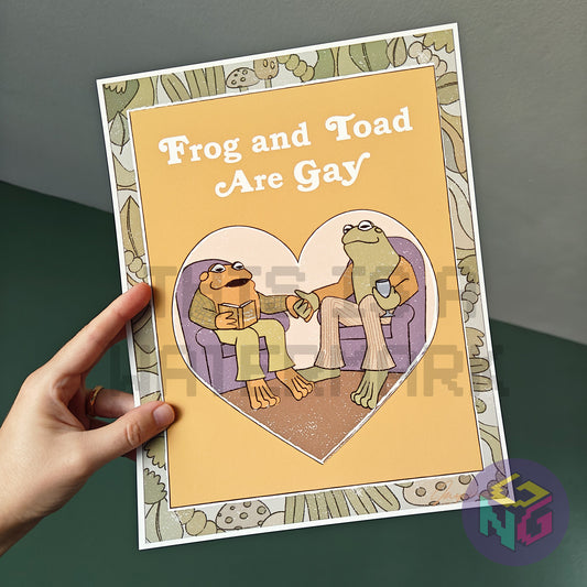 art print of imagined frog and toad book cover showing frog and toad holding hands and the title "frog and toad are gay"