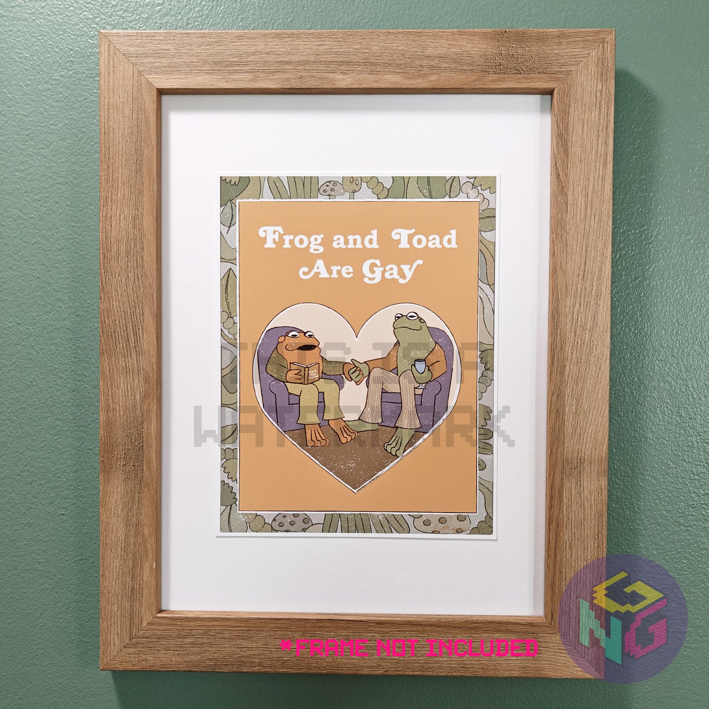 art print of imagined frog and toad book cover showing frog and toad holding hands and the title "frog and toad are gay" in a wood frame