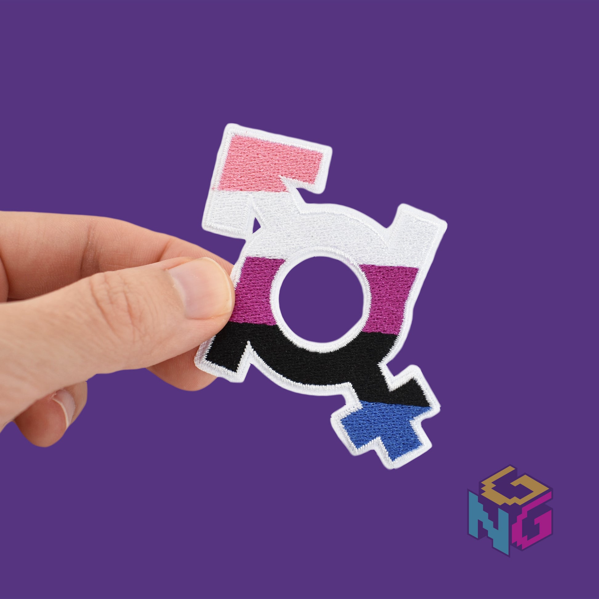 genderfluid iron on patch held in front of purple background