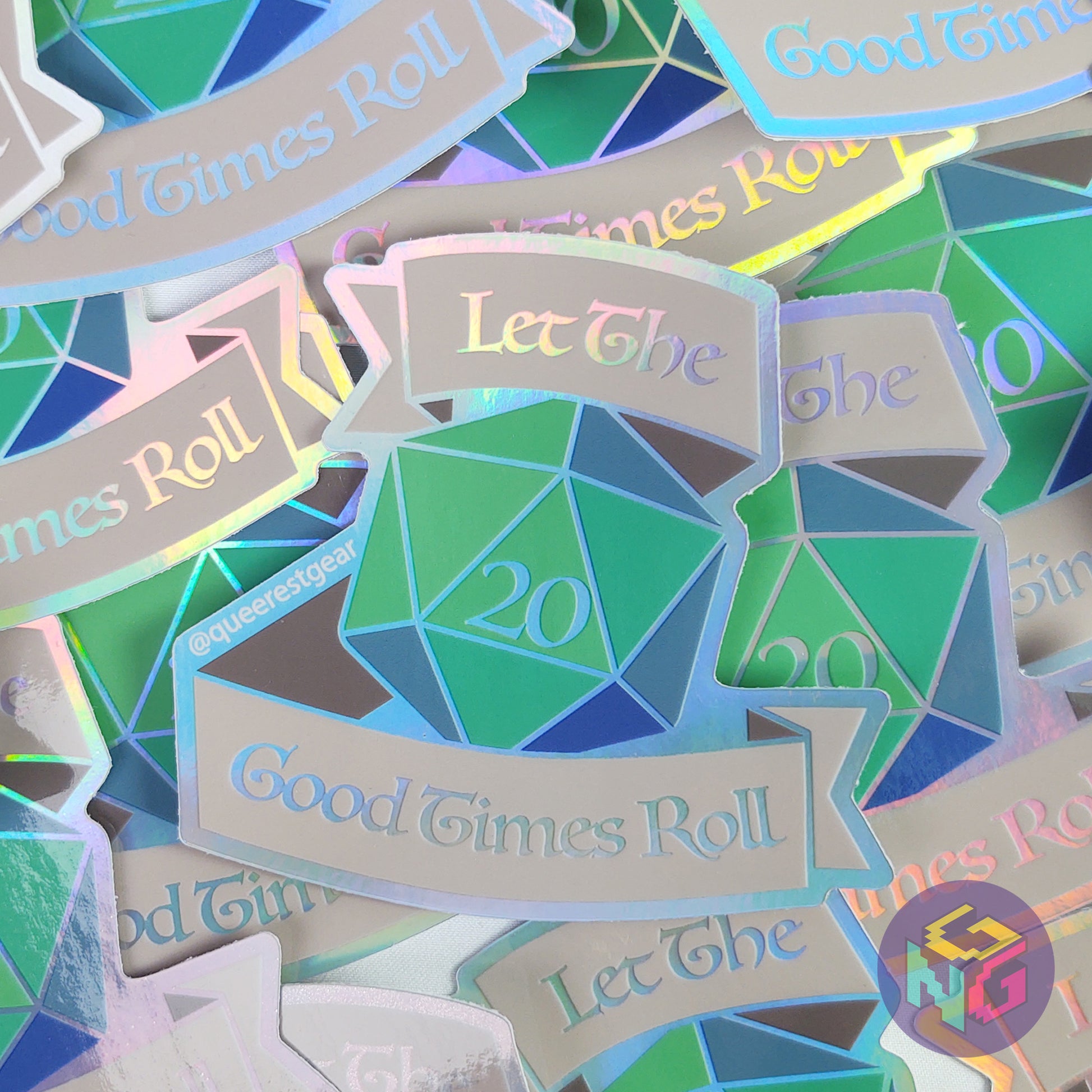 many rainbow holographic let the good times roll d20 vinyl stickers scattered in a pile