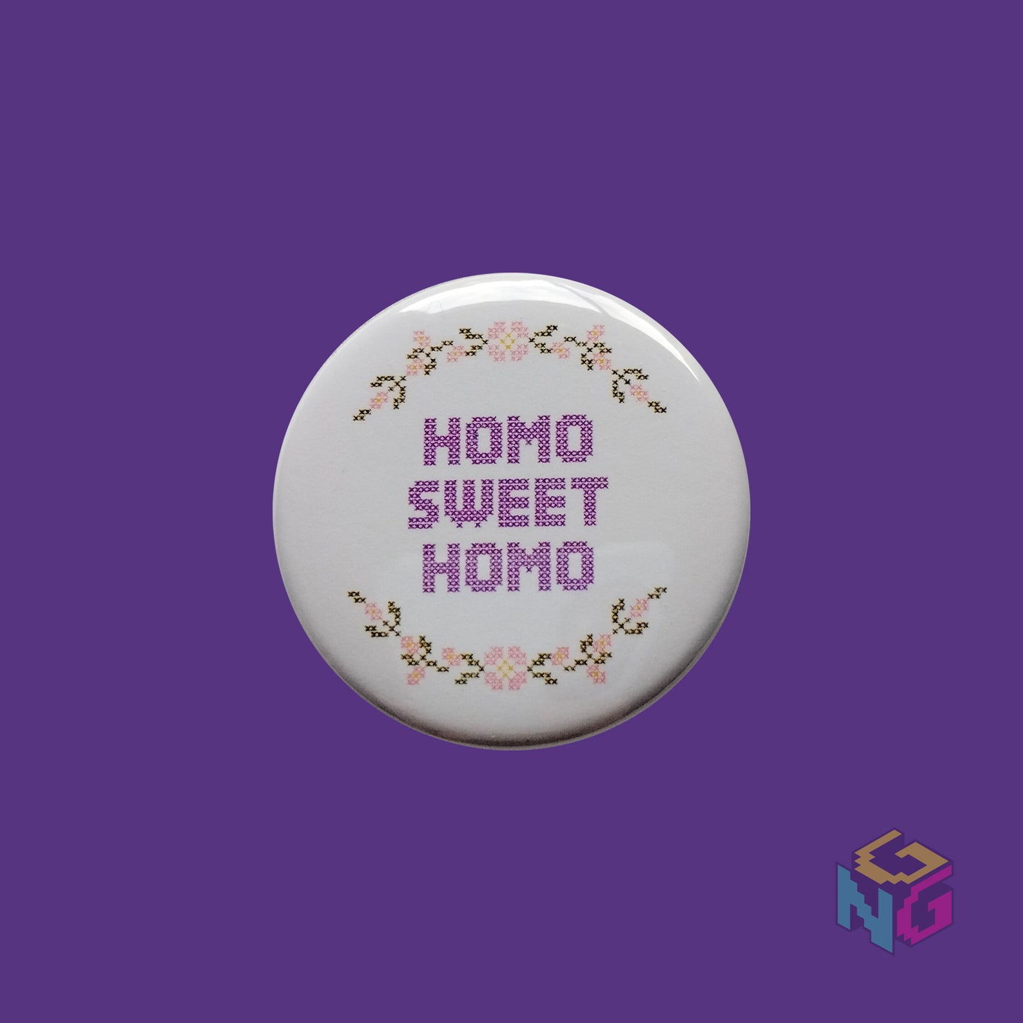 homo sweet homo button in front of purple background