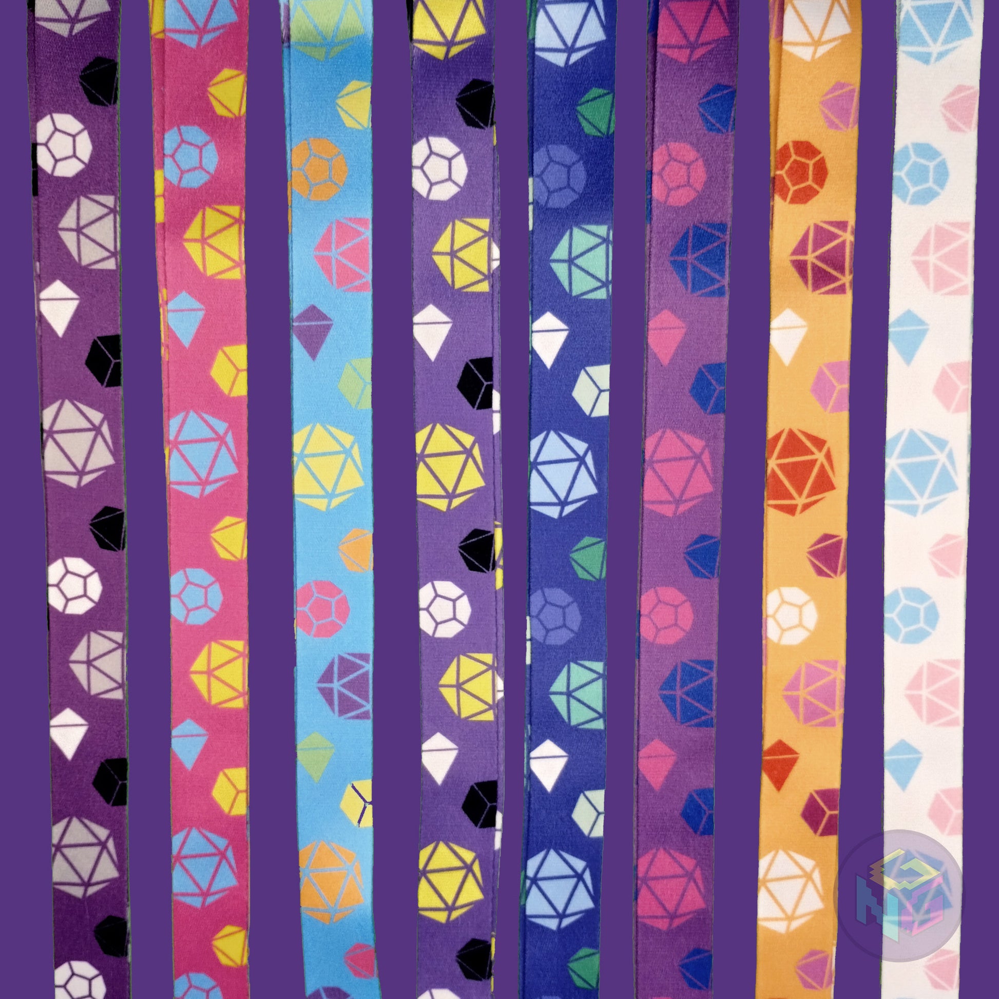 group shot of all eight of the pride dice lanyards showing the options for asexual, pansexual, rainbow, nonbinary, gay, bisexual, lesbian, and transgender