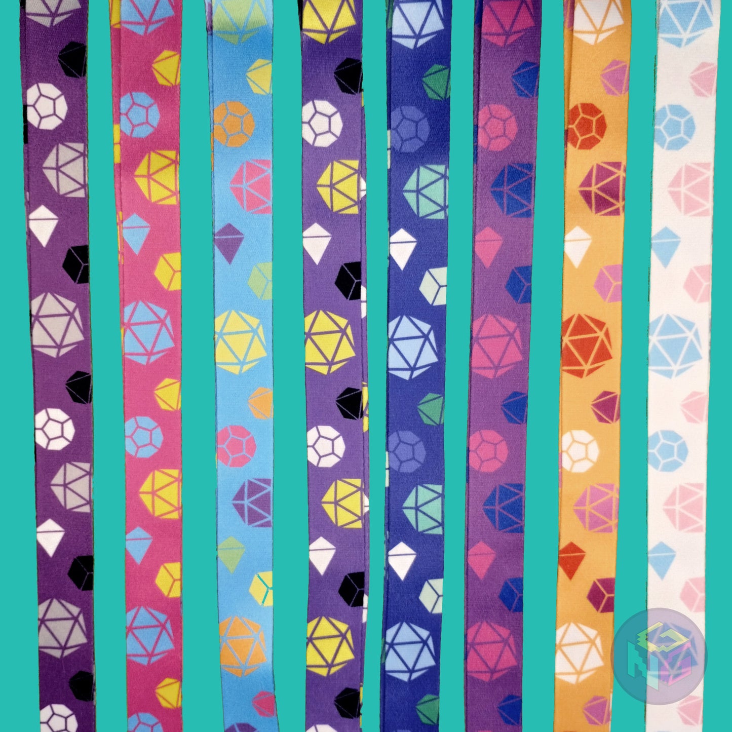 group shot of all eight of the pride dice lanyards showing the options for asexual, pansexual, rainbow, nonbinary, gay, bisexual, lesbian, and transgender