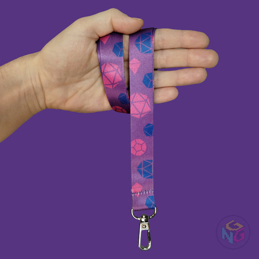 purple bisexual dice lanyard wrapped around a hand with the lobster clasp dangling against a purple background