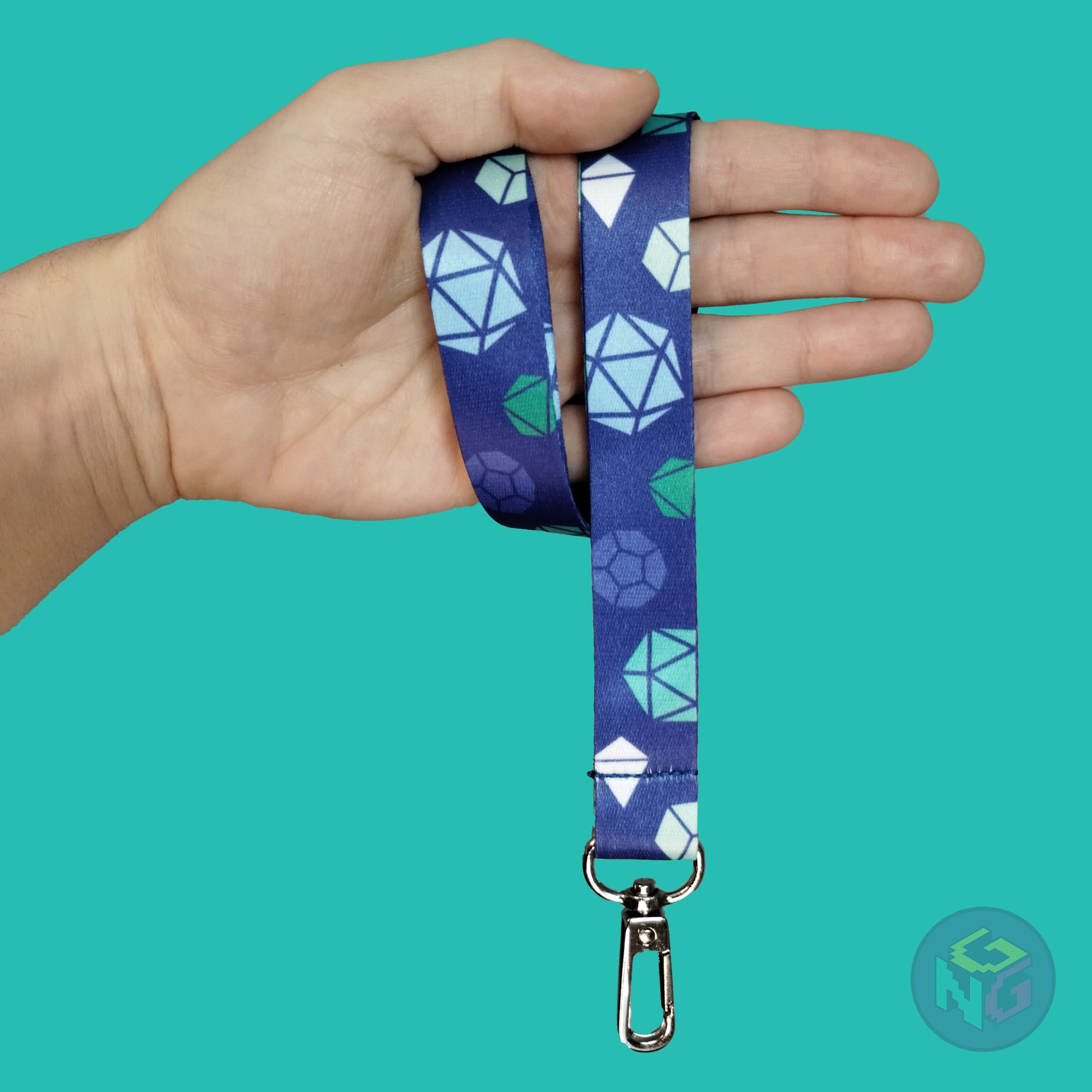 blue gay mlm dice lanyard wrapped around a hand with the lobster clasp dangling against a turquoise background