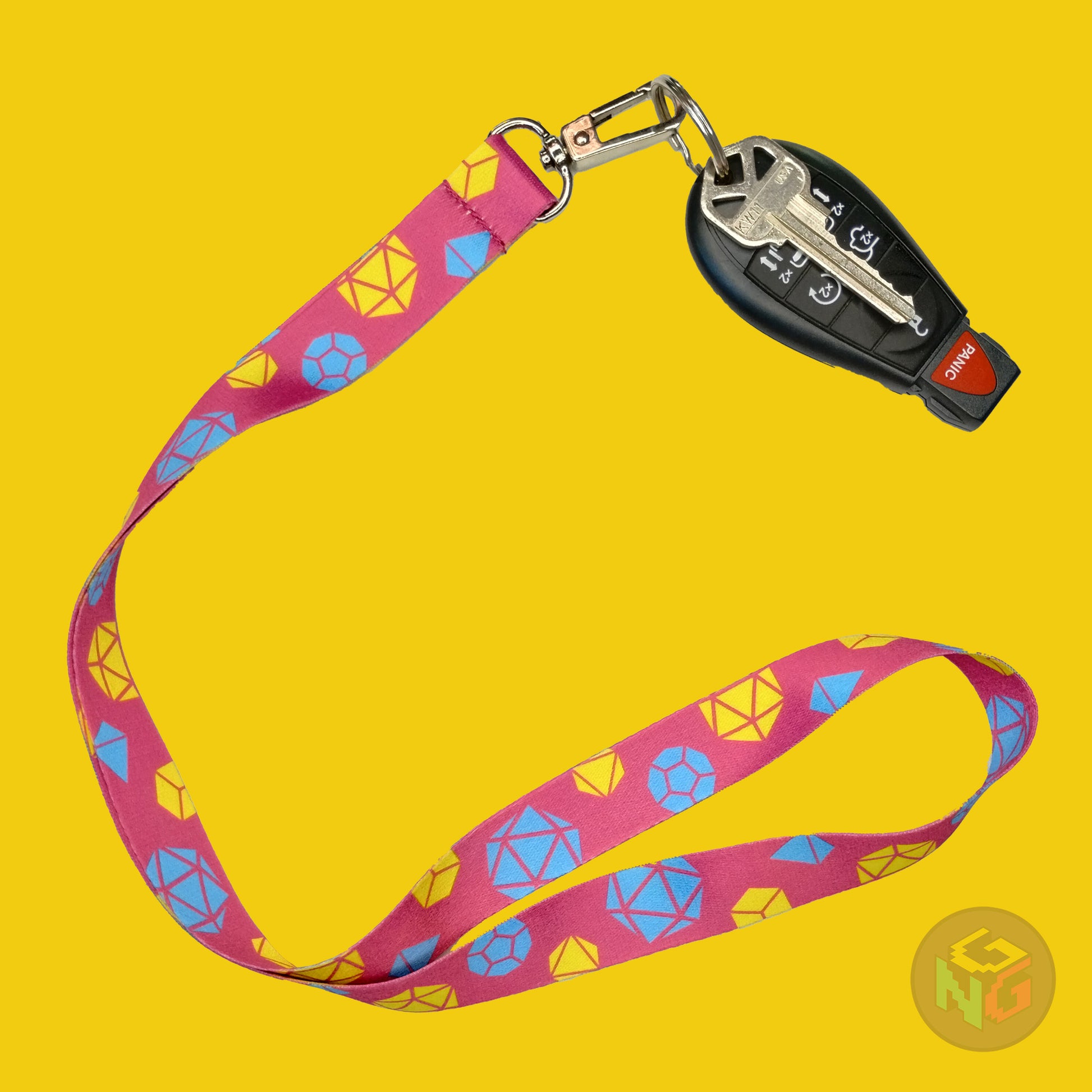 pink dnd pansexual lanyard showing the blue and yellow tabletop dice with a key fob clipped to the end of the lanyard