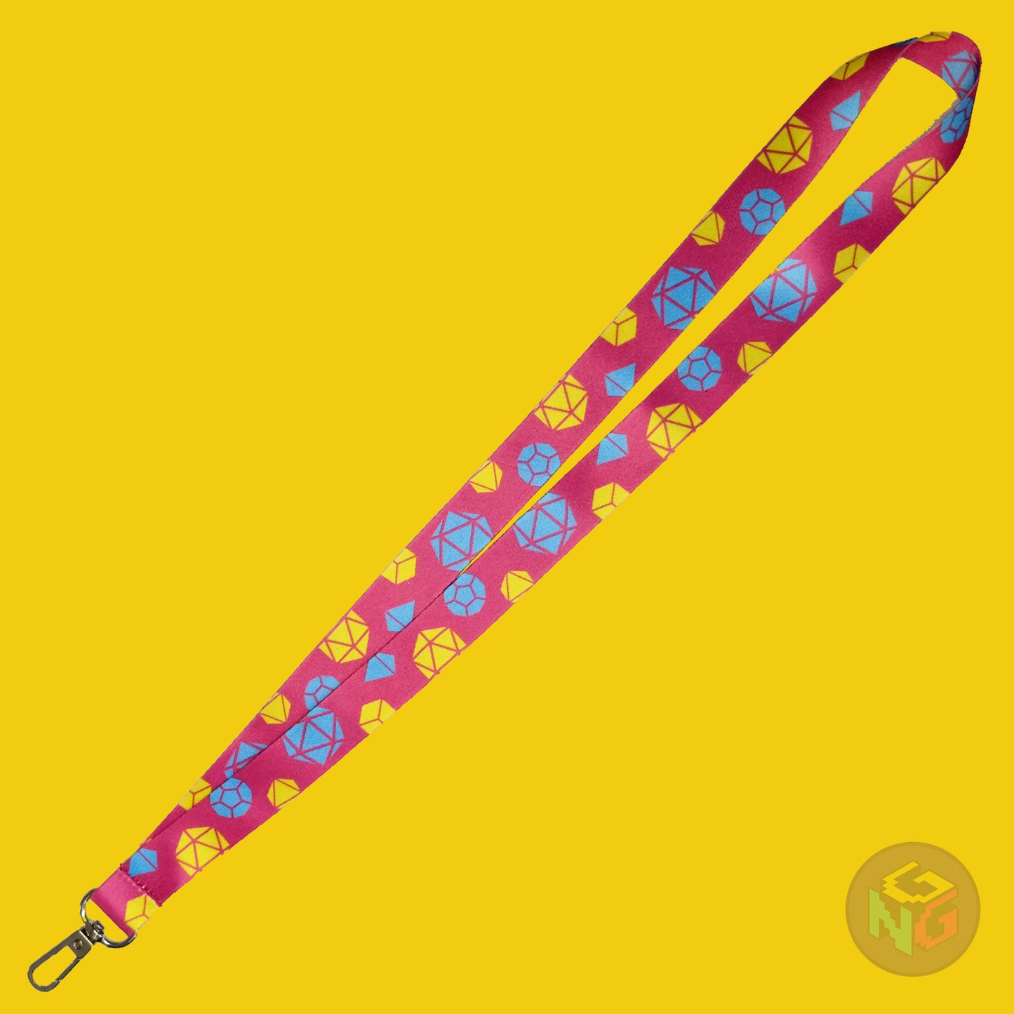 the pansexual dice lanyard lying flat showing the complete design and repeating pattern of polyhedral dice in pansexual colors