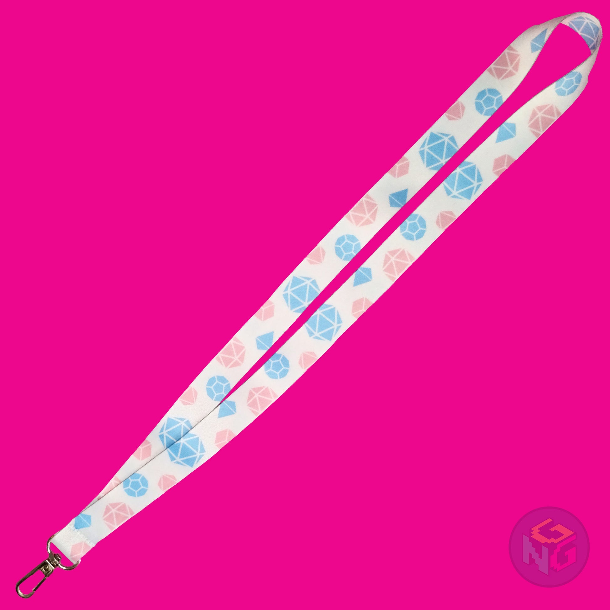 the transgender pride dice lanyard lying flat showing the complete design and repeating pattern of polyhedral dice in transgender colors