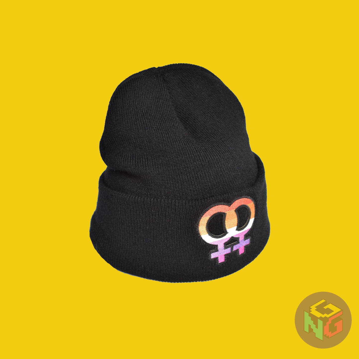 lesbian beanie stretched as if being worn in 3/4 view in front of yellow background