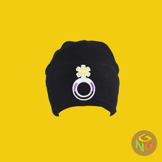 Black knit fabric beanie with the nonbinary symbol in yellow, white, purple, and black on the front. It is stretched and viewed from the front on a yellow background