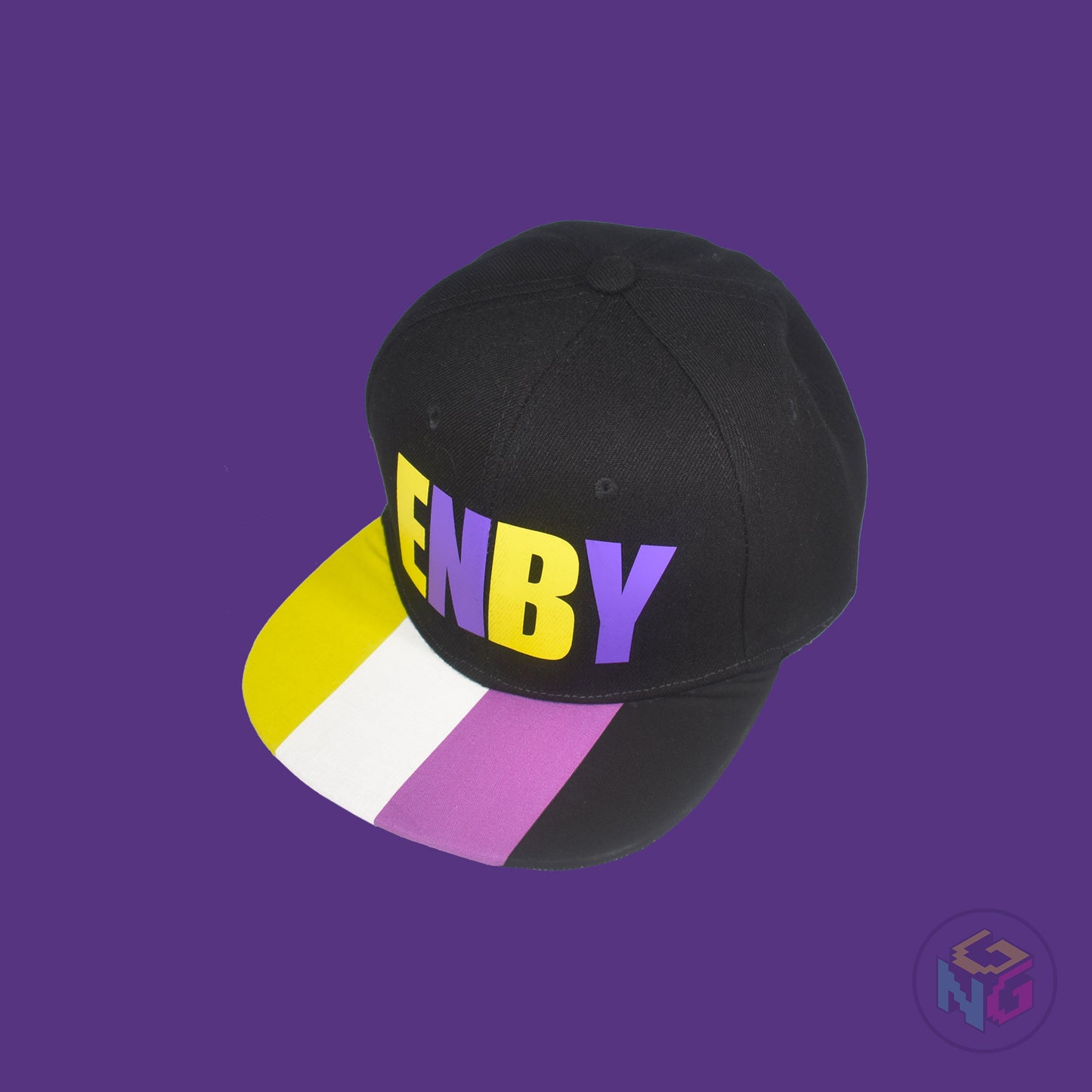 Black flat bill snapback hat. The brim has the nonbinary pride flag on both sides and the front of the hat has the word “ENBY” in yellow and purple letters. Front left view