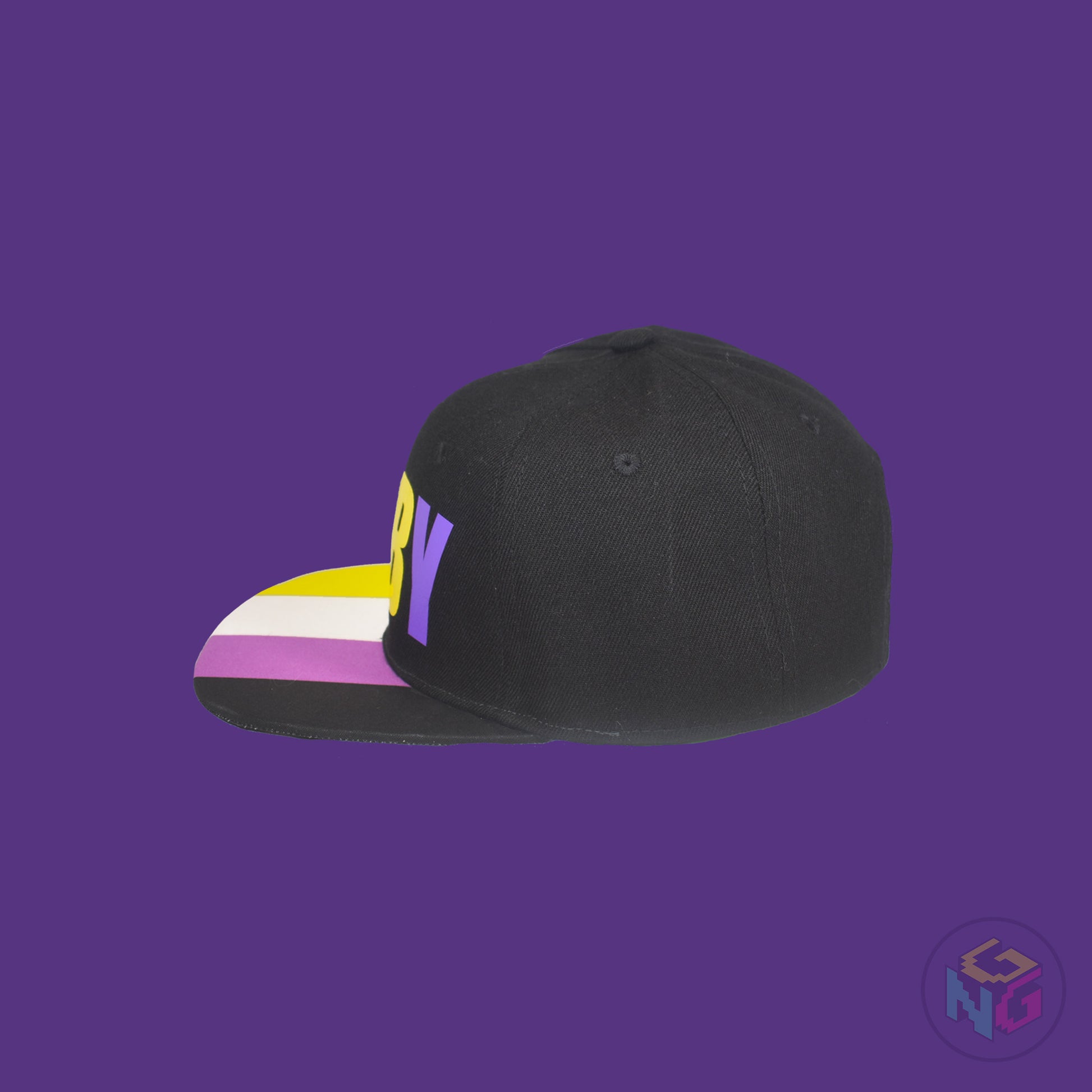Black flat bill snapback hat. The brim has the nonbinary pride flag on both sides and the front of the hat has the word “ENBY” in yellow and purple letters. Left view