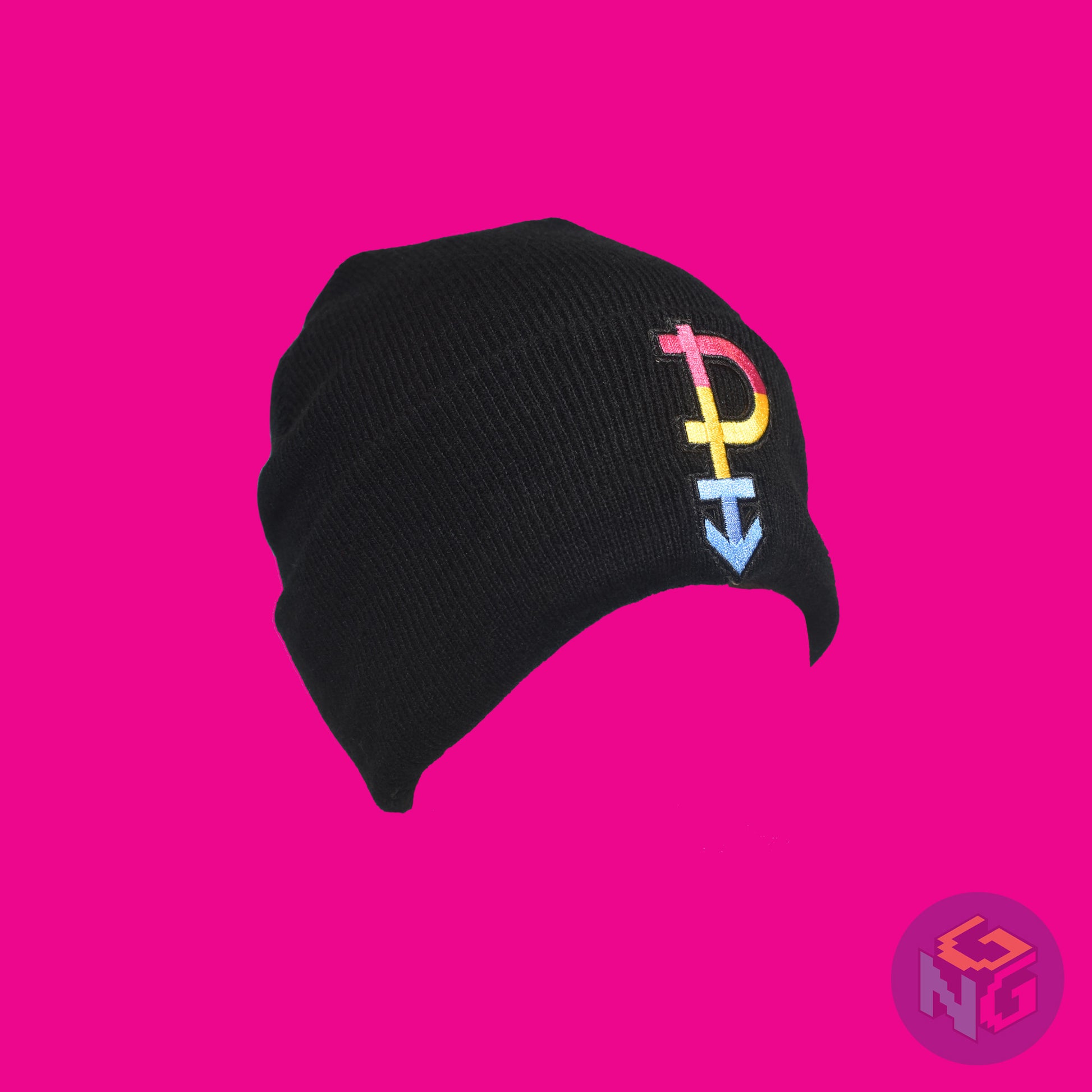 Black knit fabric beanie with the pansexual symbol in pink, yellow, and blue on the front. It is stretched and in 3/4 view on a pink background