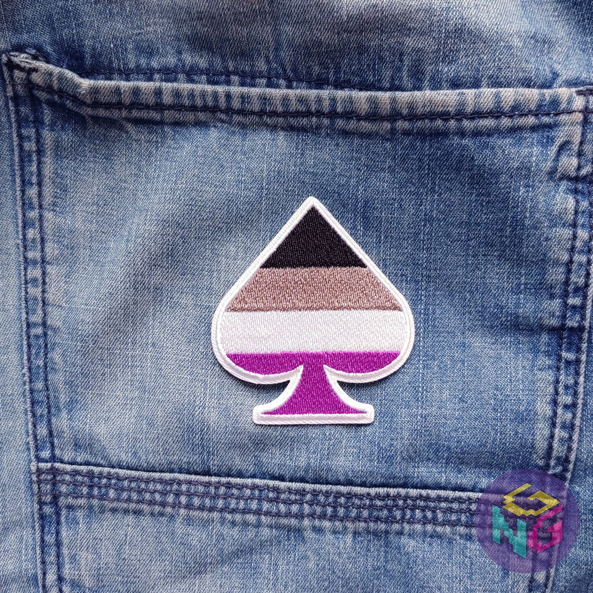asexual patch lying flat on blue denim background