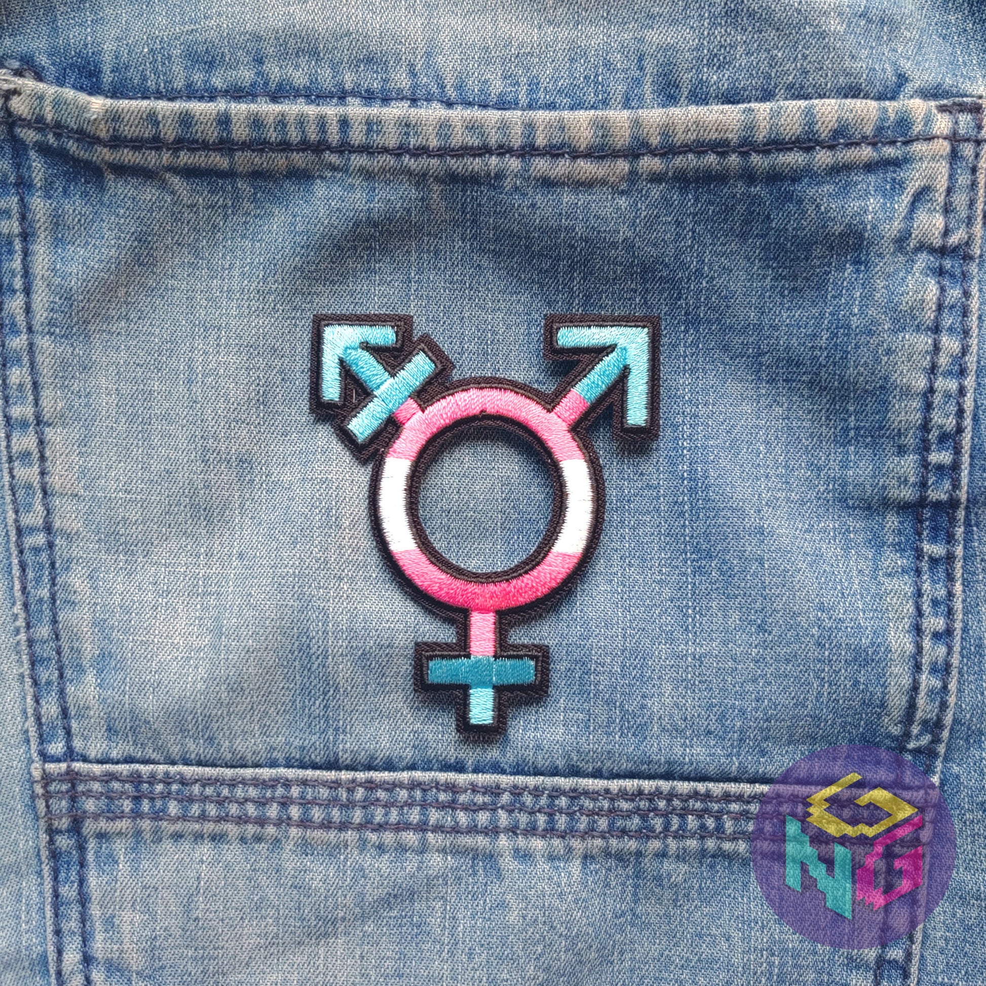 trans pride patch on denim jean background