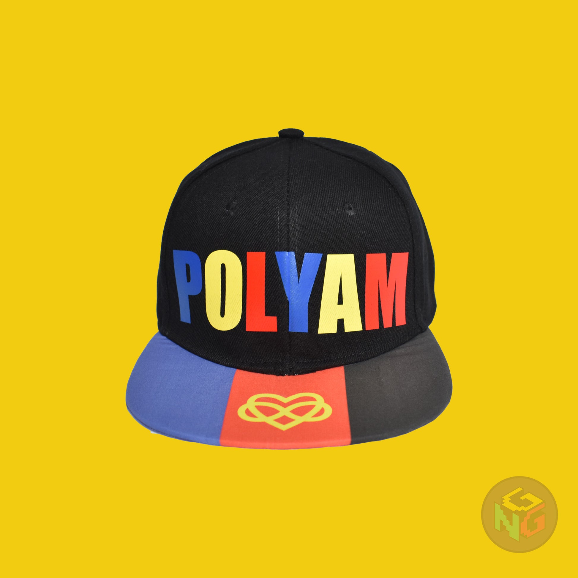 Black flat bill snapback hat. The brim has the polyamory pride flag with the heart infinity symbol on both sides and the front of the hat has the word “POLYAM” in red, yellow, and blue letters. Front view