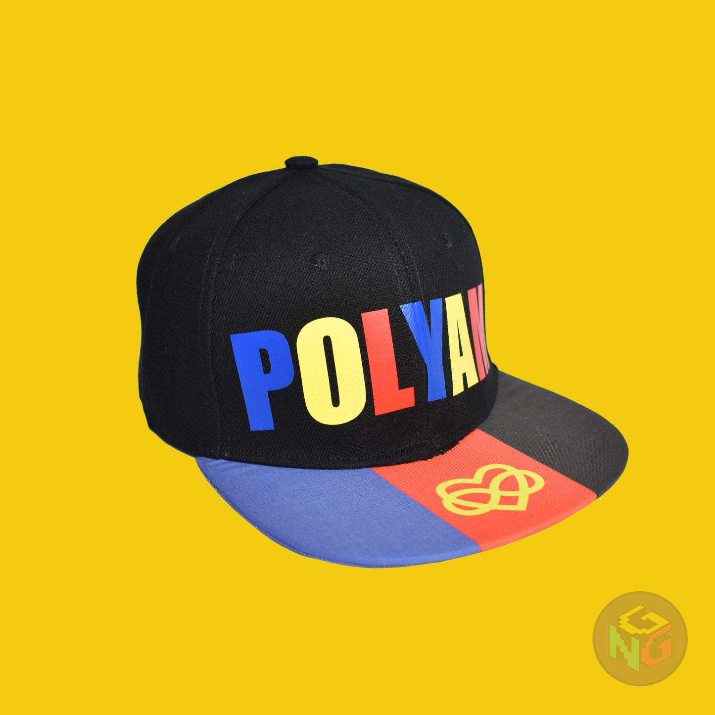 Black flat bill snapback hat. The brim has the polyamory pride flag with the heart infinity symbol on both sides and the front of the hat has the word “POLYAM” in red, yellow, and blue letters. Front right view