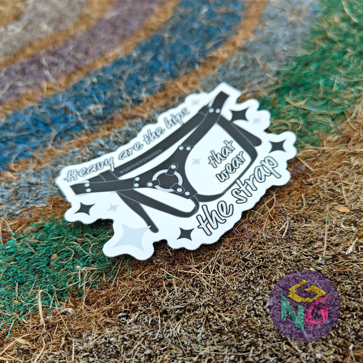 leather harness waterproof sticker with text "heavy are the hips that wear the strap"