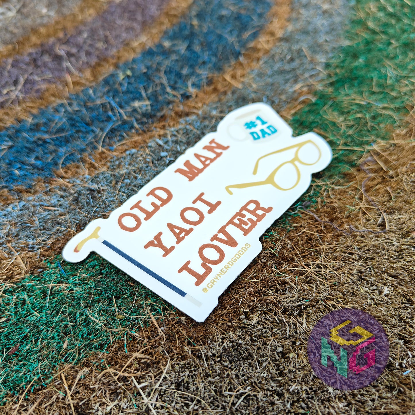fandom shipper sticker with text 'Old Man Yaoi Lover' on a textured surface