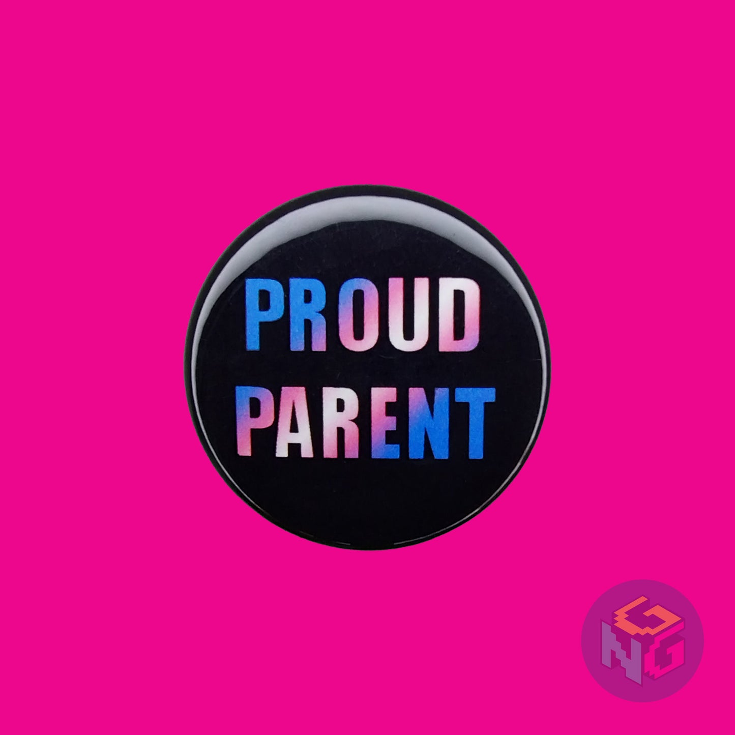 round transgender proud parent ally button on a pink background. The design features the words "proud parent" in transgender colors with a black background