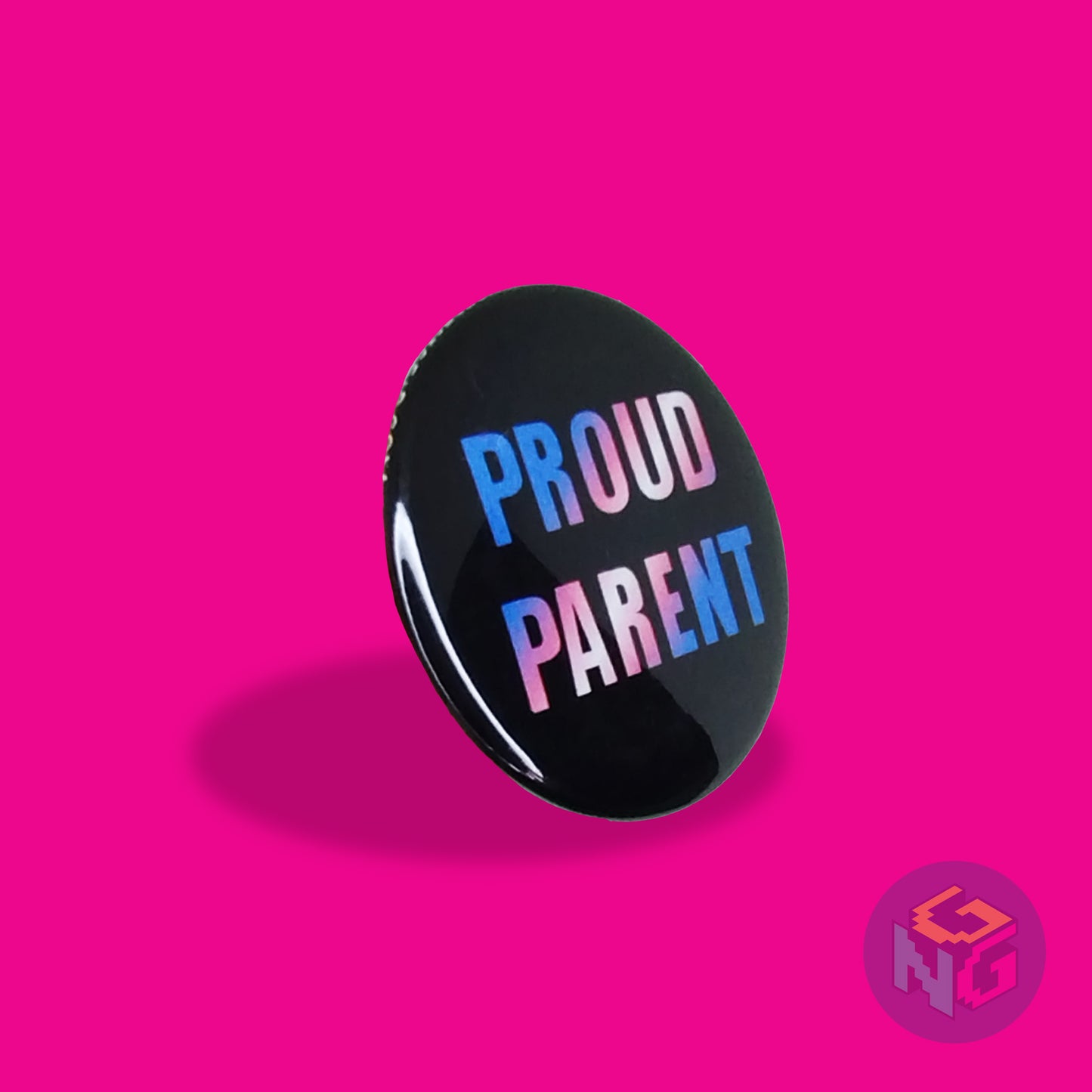 round proud parent button facing to the right on a pink background. Perfect gift for transgender allies