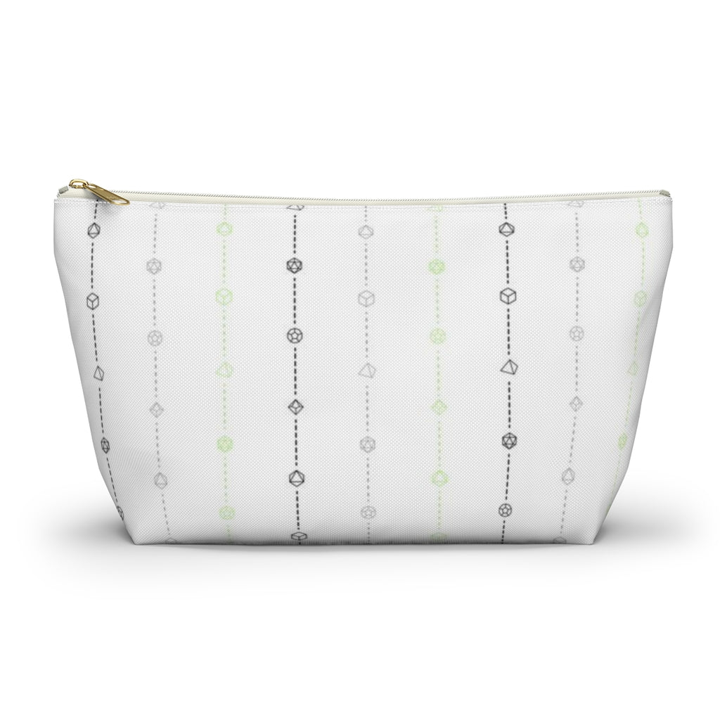 the large agender dice t-bottom pouch in front view on a white background. it's white with black, grey, and green stripes of dashed lines and polyhedral dice and a gold zipper pull