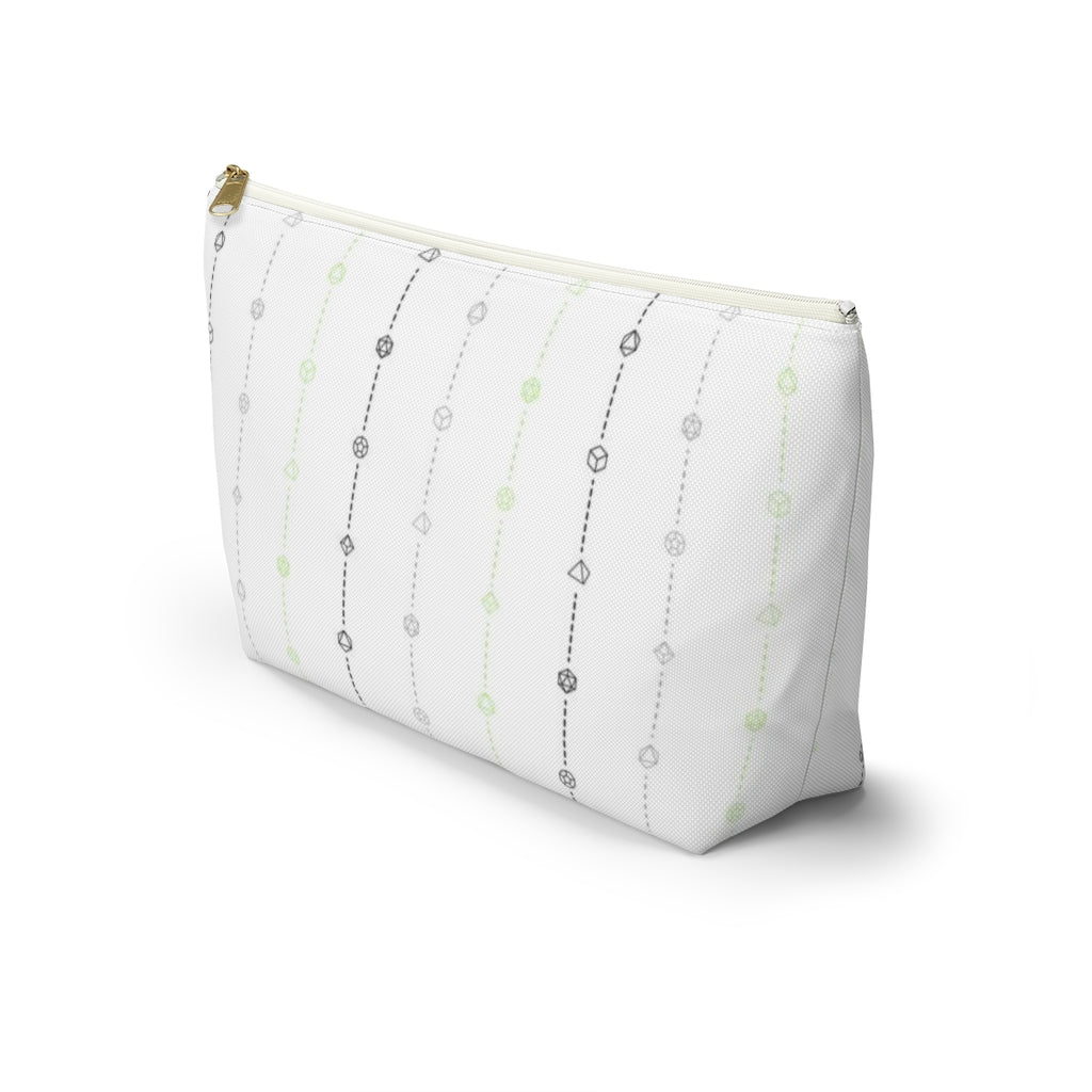 the large agender dice t-bottom pouch in side view on a white background. it's white with black, grey, and green stripes of dashed lines and polyhedral dice and a gold zipper pull