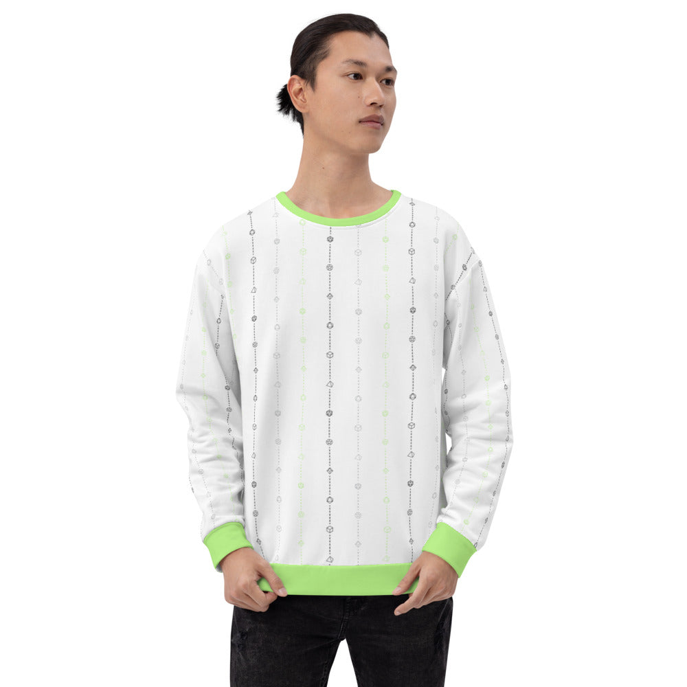 light-skinned dark haired model on a white background facing forward wearing the agender pride dice sweater