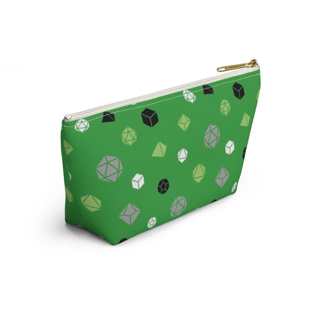 the small aromantic dice t-bottom pouch in side view on a white background. it's green with green, grey, black, and white polyhedral dice and a gold zipper pull